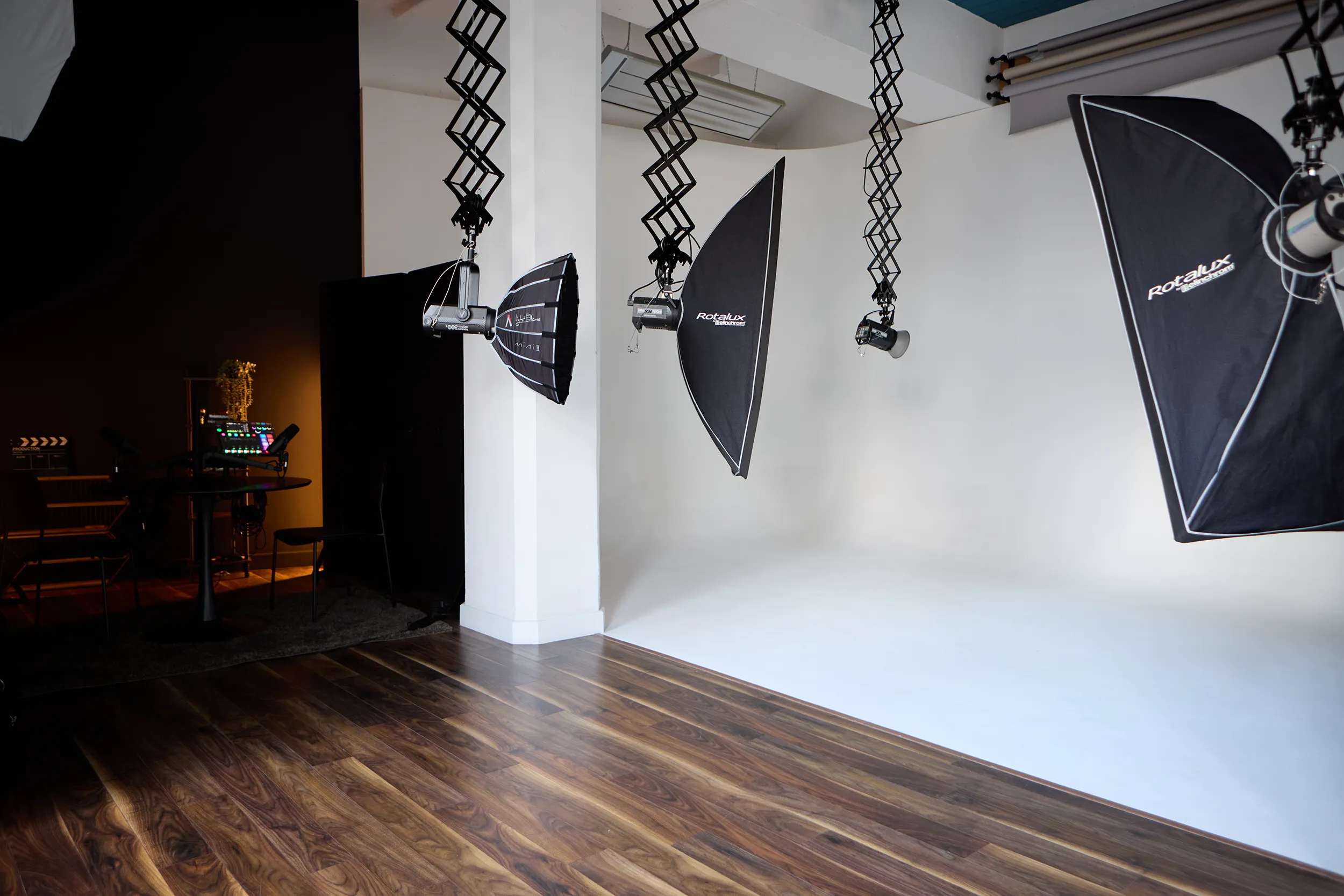 Photo studio cyclorama wall and lights on pantographs
