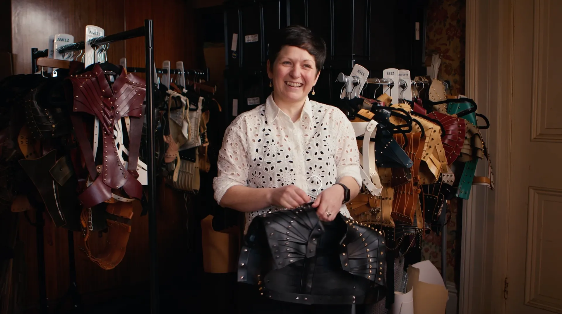 Designer Una Burke shows her leather fashion pieces while making a video for her business